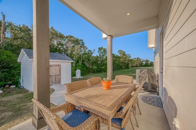 view of patio featuring a storage unit