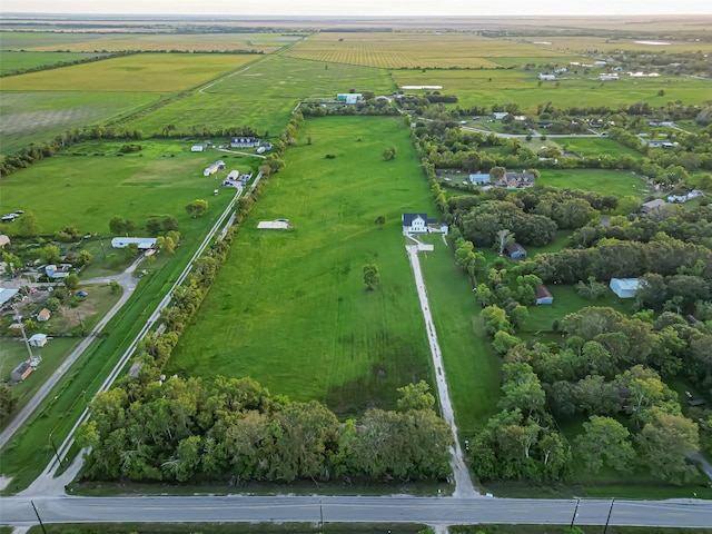 birds eye view of property with a rural view