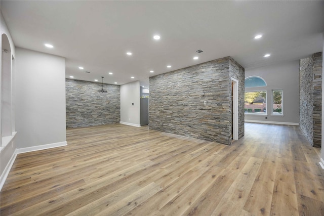 unfurnished living room featuring light hardwood / wood-style flooring