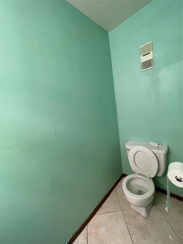 bathroom featuring tile patterned floors and toilet