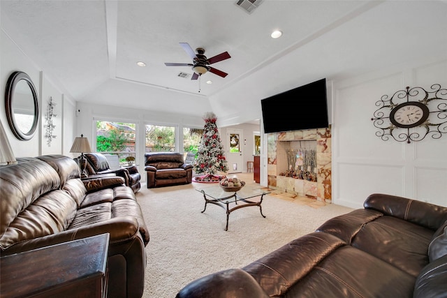 living room with carpet floors, ceiling fan, and lofted ceiling