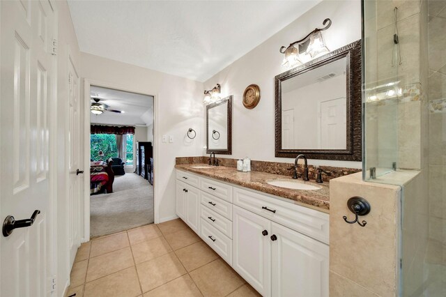 bathroom featuring a shower, ceiling fan, tile patterned floors, and vanity