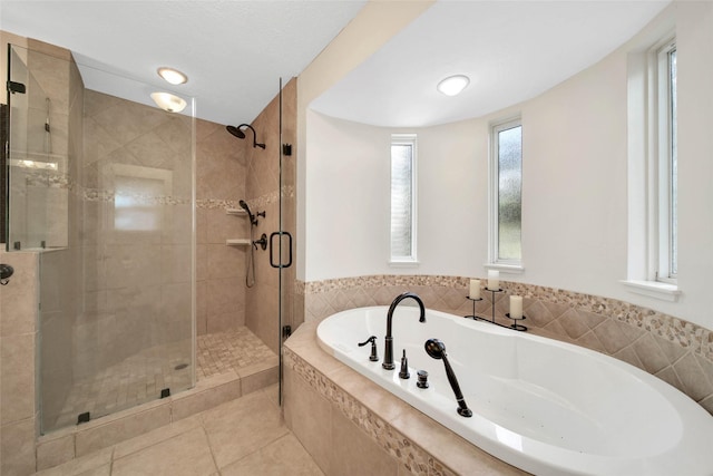 bathroom featuring separate shower and tub and tile patterned floors