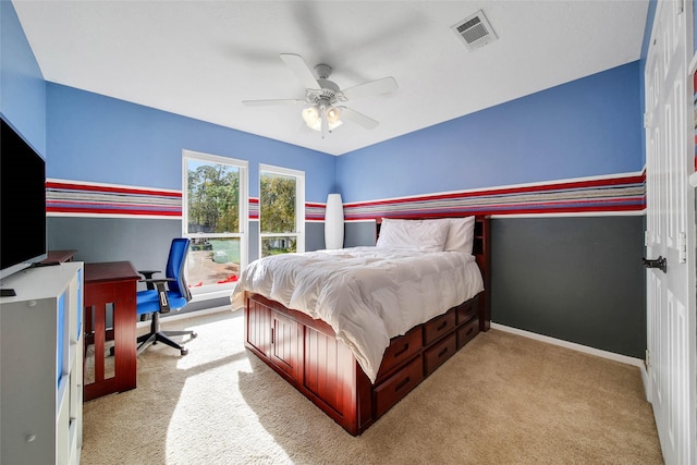 bedroom featuring ceiling fan and light carpet