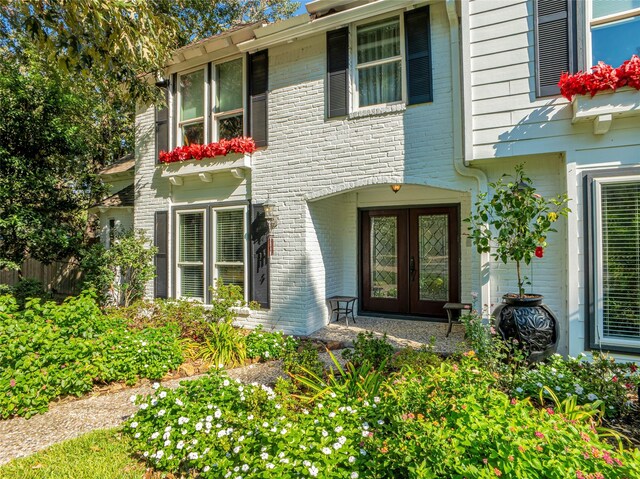 view of exterior entry featuring french doors