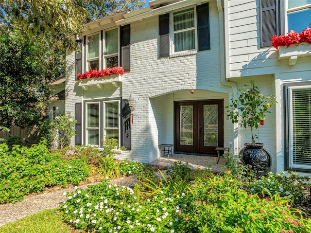 view of exterior entry featuring french doors