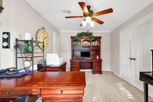 carpeted home office with ceiling fan and ornamental molding