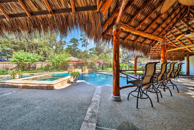 view of pool featuring an in ground hot tub and a patio area