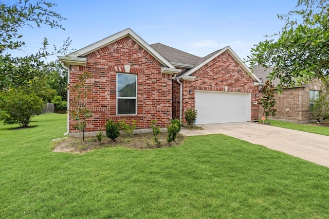 view of front of property featuring a front yard and a garage