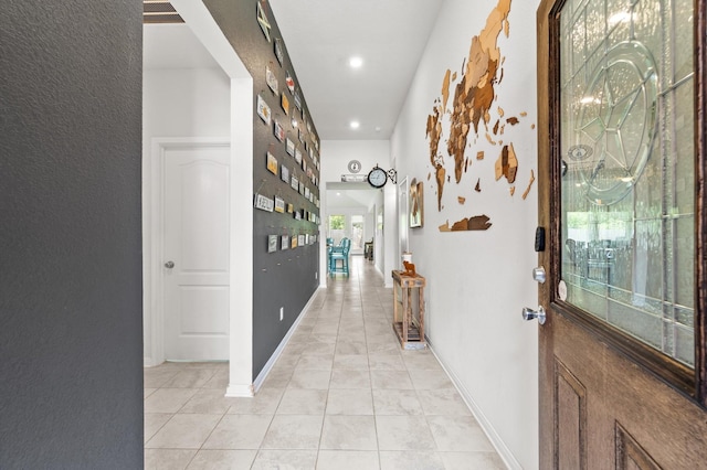 hallway with light tile patterned floors