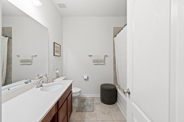 bathroom featuring tile patterned floors, walk in shower, vanity, and toilet