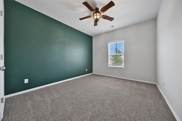 empty room with carpet and ceiling fan