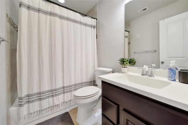 full bathroom featuring shower / bath combination with curtain, vanity, toilet, and tile patterned floors