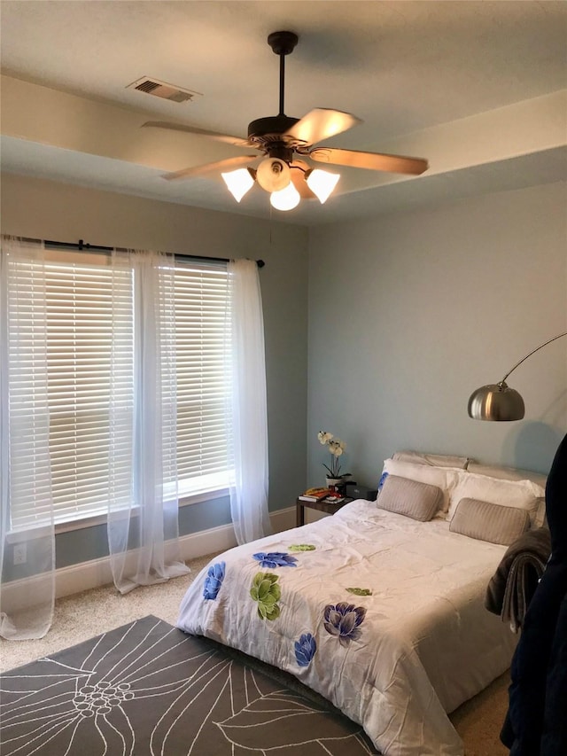 carpeted bedroom with ceiling fan