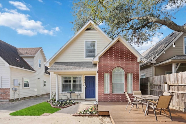 front of property with a wooden deck