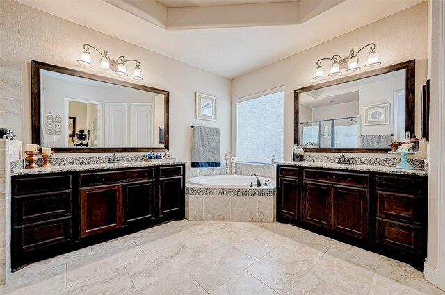 bathroom featuring plus walk in shower and vanity