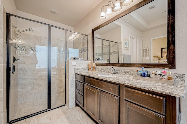 bathroom with vanity and an enclosed shower