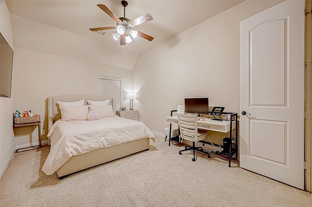 bedroom featuring ceiling fan, carpet floors, and vaulted ceiling