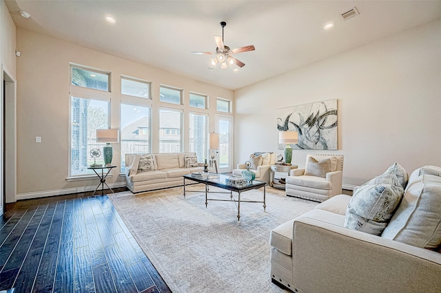 living room featuring hardwood / wood-style floors and ceiling fan