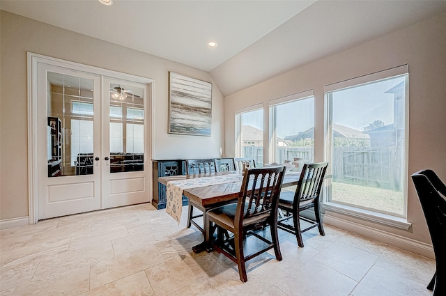 dining space featuring a mountain view, french doors, and lofted ceiling