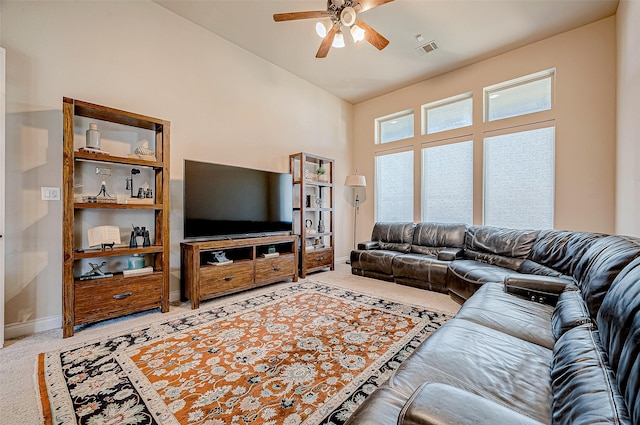 carpeted living room featuring ceiling fan