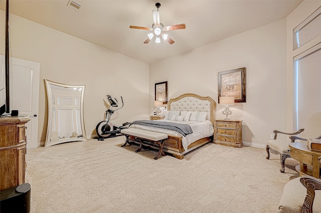 bedroom with ceiling fan and light colored carpet