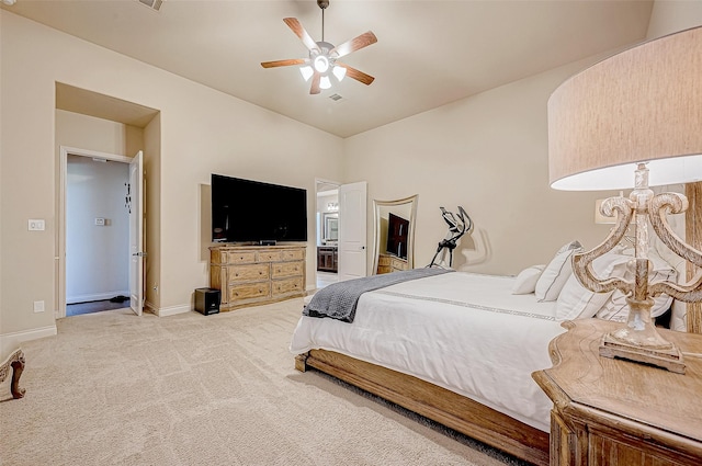 carpeted bedroom featuring ceiling fan and connected bathroom