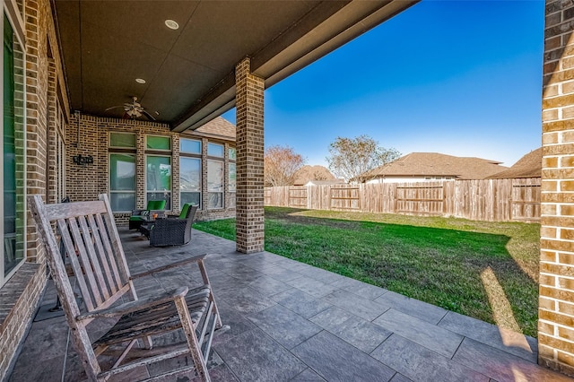 view of patio with ceiling fan