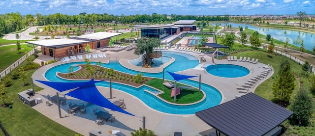 view of pool featuring a water view