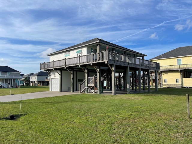 back of house with a yard and a garage