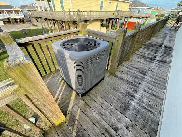 wooden deck featuring central AC unit