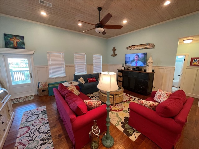 living room with dark hardwood / wood-style floors, ceiling fan, crown molding, and wood ceiling