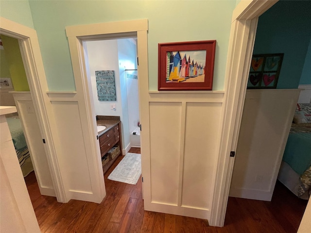 hallway with dark hardwood / wood-style floors