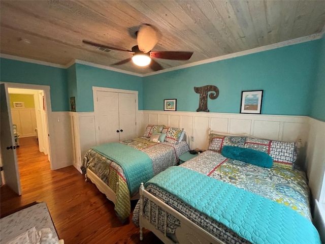 bedroom with hardwood / wood-style floors, ceiling fan, ornamental molding, and wood ceiling