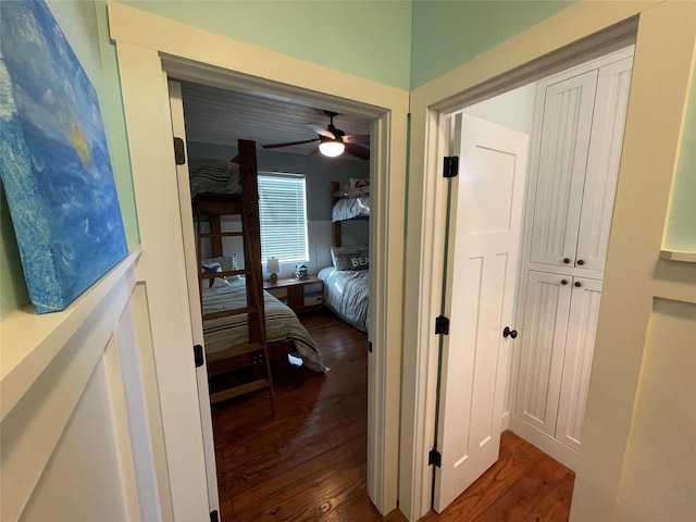 corridor with dark wood-type flooring