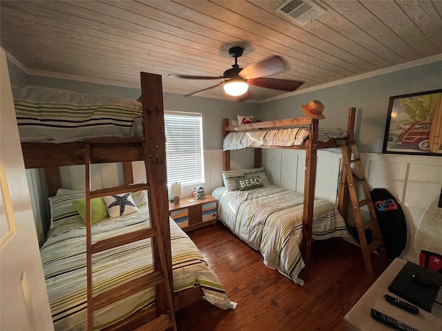 bedroom with ceiling fan, hardwood / wood-style floors, crown molding, and wooden ceiling