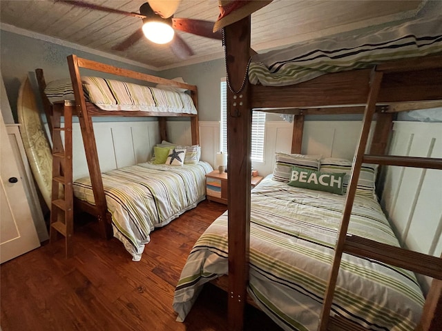 bedroom featuring ceiling fan, crown molding, hardwood / wood-style floors, and wooden ceiling