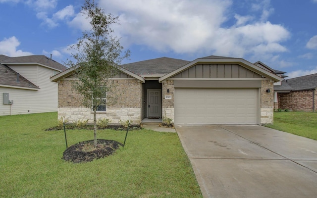 view of front of property with a front lawn and a garage