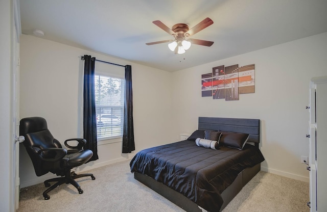 bedroom featuring light colored carpet and ceiling fan