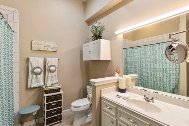 bathroom featuring tile patterned flooring, vanity, toilet, and a shower with shower curtain