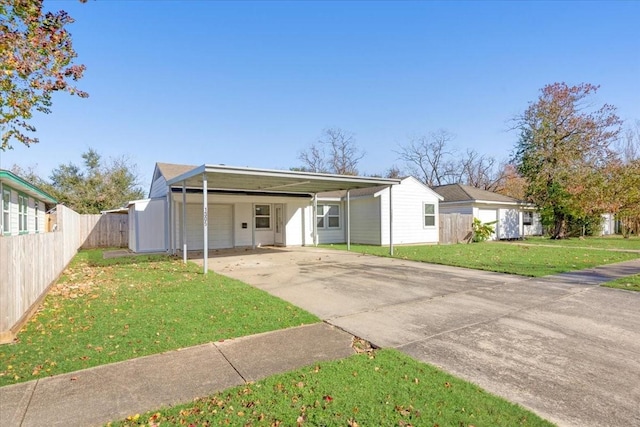 back of house with a carport and a lawn