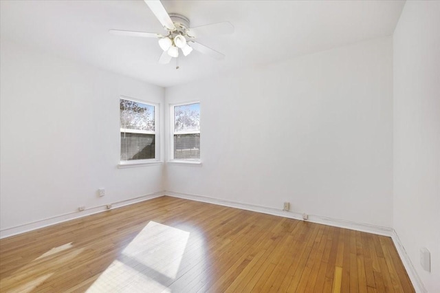 unfurnished room with ceiling fan and light hardwood / wood-style flooring