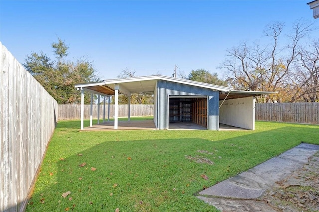 exterior space featuring a lawn and an outbuilding