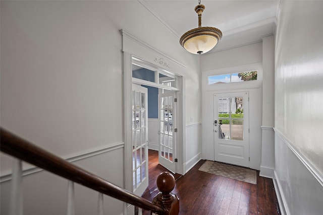 entrance foyer featuring dark hardwood / wood-style flooring and french doors