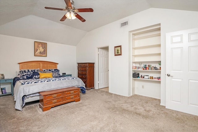 bedroom with light colored carpet, ceiling fan, and lofted ceiling