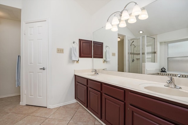 bathroom featuring tile patterned floors, vanity, an enclosed shower, and vaulted ceiling