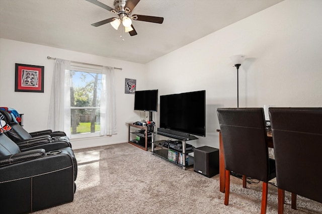 carpeted living room with ceiling fan