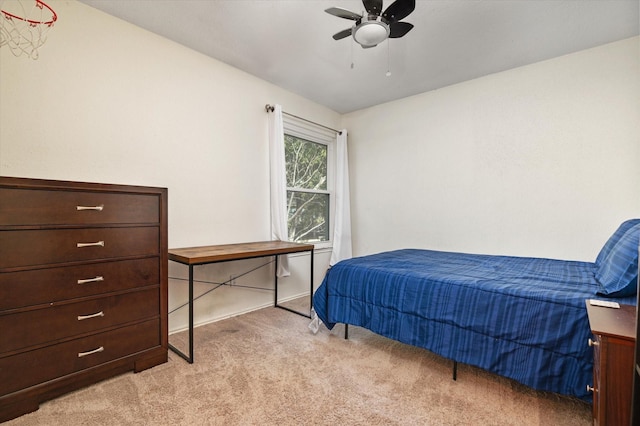 bedroom with light carpet and ceiling fan