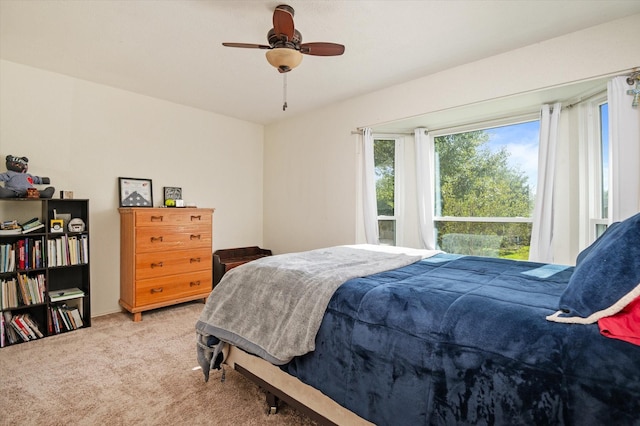 bedroom featuring ceiling fan and carpet floors