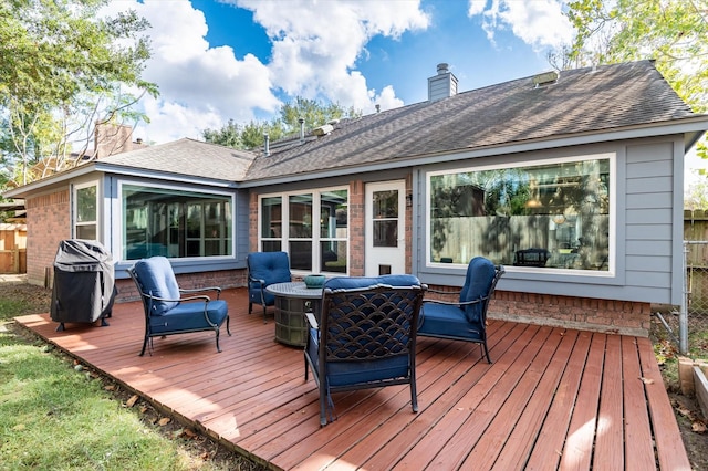 wooden deck featuring outdoor lounge area and area for grilling